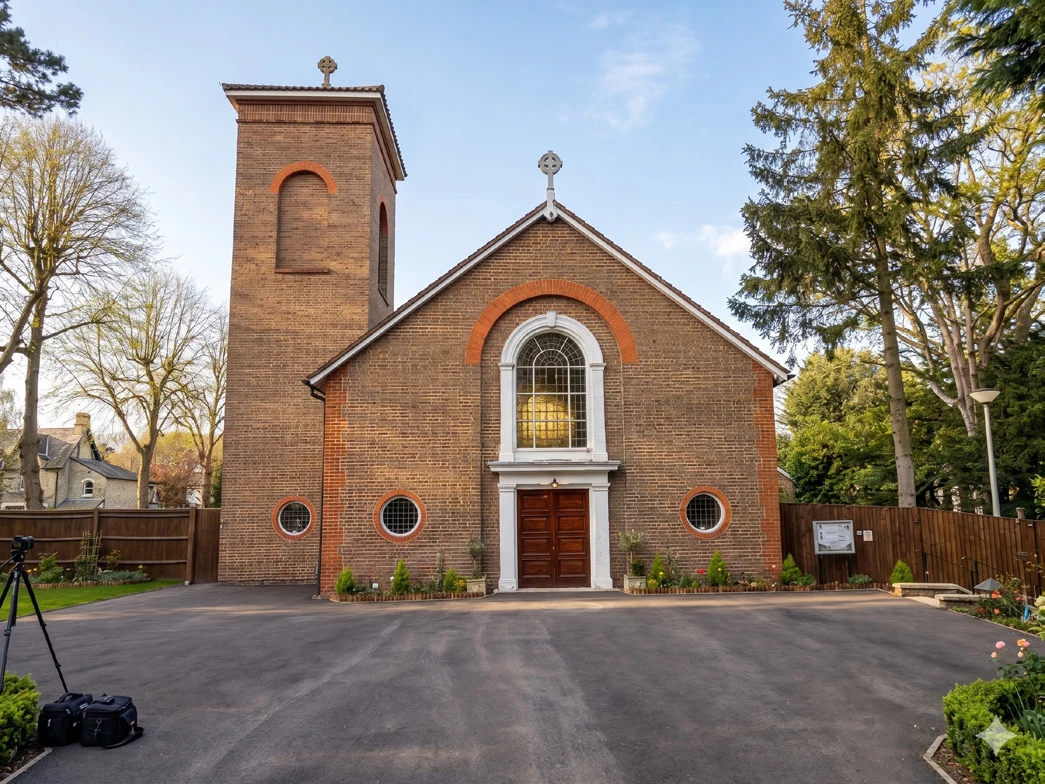 The brick façade and bell tower of St Ann’s Catholic Church, Kingston Hill.